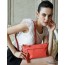 red leather messenger hand bag